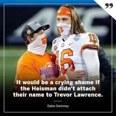 two football players with their faces painted orange and white, one is wearing a face mask