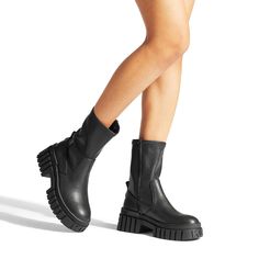 The Tegan sock boot feature a black upper with soft ankle for slip on ability. The sole is moulded with multiple KG Kurt Geiger logos. There is also a contrast KG Kurt Geiger branded tab. This product has undergone 167 checks to be registered with The Vegan Society This product arrives in a recycled and recyclable box so a plastic bag is not needed This product contains a unique KG Kurt Geiger branded outsole design that has been created specifically for this style Concealed zip on the inner side Material: Textile Style number: 0832200829 Outsole Design, Sock Boot, Boots Casual, Trainer Heels, Trainer Boots, Kurt Geiger, Mens Sandals, Black Ankle Boots, Casual Boots