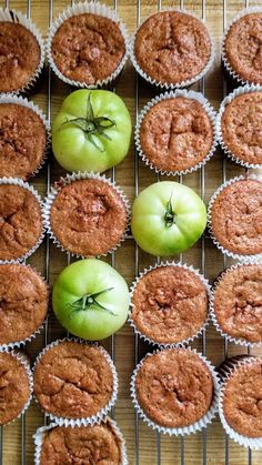 apples and muffins sitting on a cooling rack