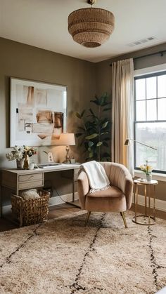 a living room filled with furniture and a rug on top of a floor next to a window