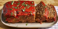 meatloaf with sauce and herbs on a plate