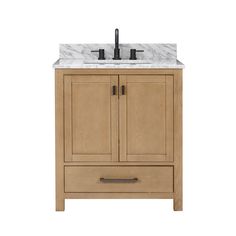 a bathroom vanity with marble top and two faucets on one side, under a sink