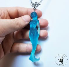 🌊Ocean drop🌊 Mermaid pendant with water effect. This mermaid is a sculpture of mine made from polymer clay, later transformed into transparent colored resin. Its measurement is 0.787402 inches base x 3.14961 inches high.  The perfect gift for lovers of fantasy and the unusual.  The chain is 19.685 centimeters long and is made of stainless steel, it will be shipped in protective packaging with decorative tape.  For any information do not hesitate to contact me. :) Sea Siren, Creature Fantasy, Element Necklace, Ocean Inspired Jewelry, Mermaid Pendant, Water Effect, Mythical Creature, Mermaid Necklace, Decorative Tape