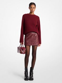 Made from washed leather, this chic mini skirt is endlessly versatile. Pair the fitted silhouette with a cozy oversize sweater for an effortless cool-weather ensemble. Red Leather Mini Skirt Outfit, Red Winter Party Mini Skirt, Burgundy Leather Skirt Outfit, Leather Skirts Red, Mini Skirt With Boots, Faux Leather Skirt Red, Dark Red Leather Skirt, Chic Mini Skirt, Leather Mini Skirt Outfit