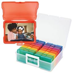 an open plastic box filled with lots of different colored boxes next to each other on a white background