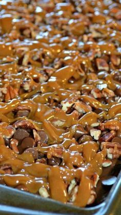 a pan filled with caramel pecans and nuts