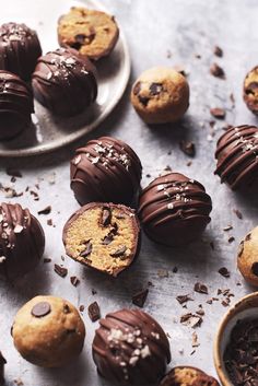 chocolate covered cookies and other desserts on a table