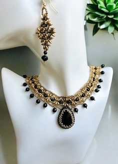 Black and Gold Necklace Set - black spinel and gold super duo Beads. Necklace and Earrings, **Handmade Dainty Boho Chic Choker Necklace, Perfect for Evening Wear and Gift** ### Introduction Semi-precious gemstones boast stunning luster and sparkle, sure to become your signature piece. Adjustable from approximately 14 inches to 18 3/4 inches. Earrings are 2" long. ### Product Details **Materials - High-quality 8mm spinel beads and 2mm sbeads - Glass beads - 14K Gold Filled lobster clasp closure type **Dimensions - Necklace length: 14" to 18" adjustable **Features - Handcrafted with care - Lightweight and comfortable - Adjustable length ### Usage and Occasions Perfect for parties, weddings and evening wear. Makes a great gift. ### Care Instructions Store in a dry place and clean gently with Black And Gold Necklace, Super Duo Beads, Duo Beads, Super Duo, Earrings Indian, Choker Set, Gold Necklace Set, Wedding Jewellery Necklace, Black Spinel