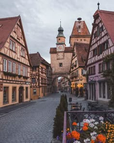 a cobblestone street lined with tall buildings