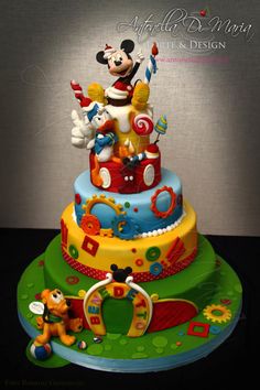 a mickey mouse birthday cake on top of a table