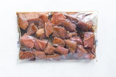 a bag filled with meat sitting on top of a table