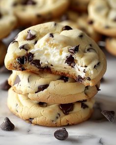 chocolate chip cookies are stacked on top of each other