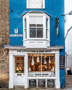 the little fish and chip shop is painted blue