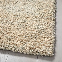 a white area rug on the floor