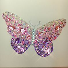 a butterfly made out of crystals and jewels