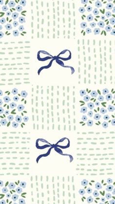 a blue and white flower pattern with a bow on it