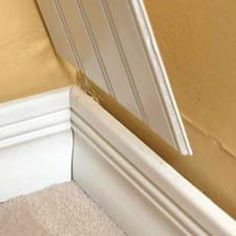 the corner of a room that has been painted yellow