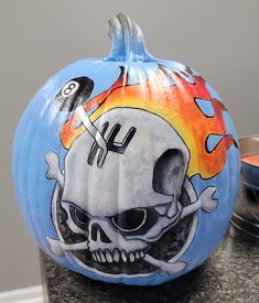 a painted pumpkin with a skull on it