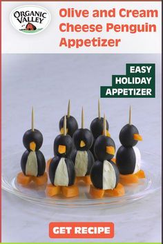 an advertisement for olive and cream cheese penguin appetizer