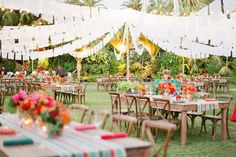 tables and chairs set up for an outdoor party