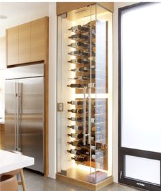 a wine rack in the middle of a kitchen