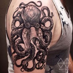 an octopus tattoo on the arm and shoulder