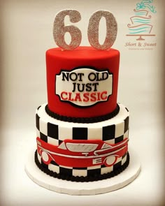 a red and black cake with silver numbers on top that says 60 not just classic