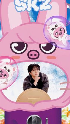 the poster shows an image of a pink pig with two different faces on it's face