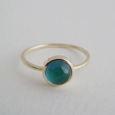 "Bring a touch of fall magic with our playful, color-changing mood stone ring! A grown-up twist on the classic mood ring, this beauty shifts colors like autumn leaves. Whether you wear it solo or stack it with your favorite rings, it's a fun, stylish way to reflect your mood. Made with high-quality materials, it's a seamless piece built to last all season long and beyond!" Our rings are plated with 18k gold, 18k rose gold, or sterling silver and finished with a protective coating. (NOTE - Sizes 8 and up are ring adjustable for a perfect fit.) Blue - happy  Purple - inspired  Green - relaxed Yellow - excited  Orange - on the edge Pink - love  By Honeycat Printable Ring Size Chart, Classic Mood, Mood Stone, Delicate Gold Jewelry, Multiple Rings, Cubic Zirconia Engagement Rings, Mood Ring, Delicate Jewelry, Favorite Rings