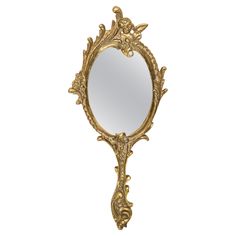 an ornate gold mirror on a white background