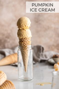 an ice cream cone in a glass jar with the words pumpkin ice cream on it