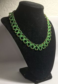 A handmade glass beaded necklace that is perfect for any occasion: parties, holidays, birthdays, anniversaries. All products are hand-crafted by my mother. Dimensions: - Actual Length: 21.0 cm - Collar Length: 13.0 cm - Width: 13.0 cm - Height: 2.0 cm Lightweight, high quality with a beaded hook as a clasp. Will respond to concerns and suggestions promptly. Shipping costs: Free Domestic Shipping. All orders are sent by air-mail with tracking number. Time of delivery: Estimated 1-3 days for domes Handmade Green Beaded Bracelets With Oval Beads, Adjustable Beaded Necklaces With Bead Caps, Handmade Czech Glass Jewelry With Oval Beads, Handmade Oval Glass Beads, Handmade Green Oval Beads Jewelry, Handmade Czech Glass Round Necklaces, Handmade Green Oval Beaded Jewelry, Celebration Green Beaded Necklace With Colorful Beads, Handmade Round Glass Beads