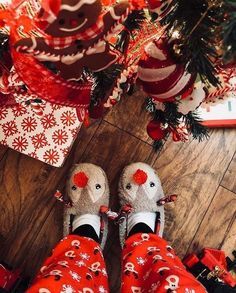 someone is wearing red and white christmas pajamas