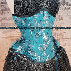 "Brand New underbust corset from \"MystiC City Corsets\" design: MCC-44L color: Picture ( teal cherry brocade) - 100% cotton twill lining - Steel boned (18 x 6mm wide spiral steel bones, 6 x 12mm wide flat steel bones ) - Front busk(black) - Underbusk - Steel boned floating modesty panel - regular \"shoe\" style lace Front: 11.25\" Side: 9-10.5\" Back: 12\" Busk: 9.75\" (black, Flexible) available sizes: 18\", 22\", 24\" ,26\", 28\", 30\", 32\" , 34\", 36\"" Blue Corset Dress With Fitted Bodice, Blue Corset With Boned Bodice, Blue Fitted Underbust Corset Dress, Fitted Gothic Green Corset, Green Overbust Corset For Costume Party, Blue Fitted Corset For Costume Party, Blue Overbust Corset For Costume Party, Blue Overbust Corset With Boned Bodice, Blue Underbust Corset With Fitted Bodice