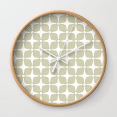 a wall clock with an abstract pattern on it