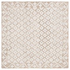 a beige and white rug with an intricate design