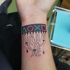 a person with a tattoo on their arm that has an xoxo printed on it