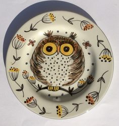 a plate with an owl painted on it