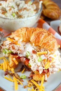 a croissant filled with chicken salad and cheese