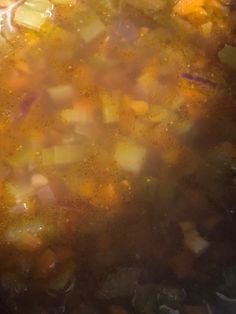 a pot filled with soup sitting on top of a stove