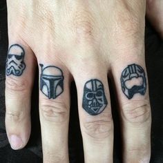 two fingers with star wars tattoos on them