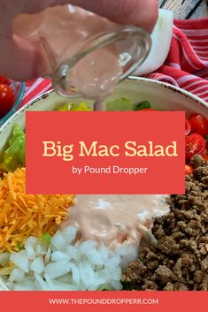 a big mac salad with dressing being drizzled over it