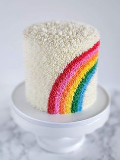 there is a cake that has been made to look like a rainbow