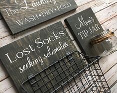 two signs that say laundry room, the laundry room and lost socks seeking selves