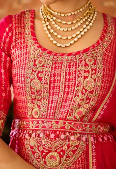 Step into refined elegance with the scarlet red maroon hand-embroidered pleated silk brocade kurta and lehenga set. The pleated brocade kurta is adorned with intricate hand embroidery, perfectly complemented by a flowing multi-panel brocade lehenga. An embroidered belt adds structure, while the matching dupatta completes this ensemble, making it a stunning choice for any grand occasion. Kurta And Lehenga, Brocade Kurta, Maroon Lehenga, Brocade Lehenga, Embroidered Belt, Casual Tunics, Silk Brocade, Red Maroon, Silk Organza