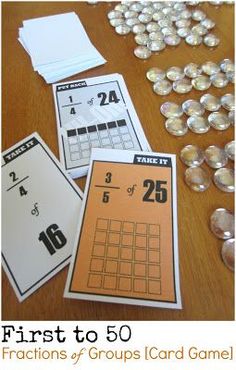 the first to 50 fractions and groups card game is shown with coins scattered around it