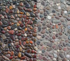 two different colored rocks on the side of a building