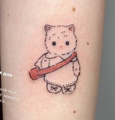 a cat with a baseball bat tattoo on the leg