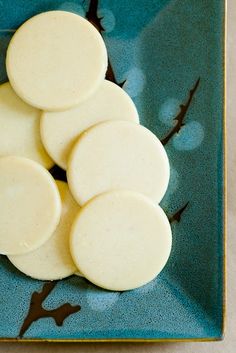 a blue plate topped with cut up cookies