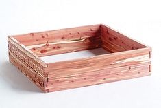 a wooden box sitting on top of a white table